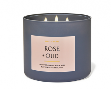 a grey 3 wick candle