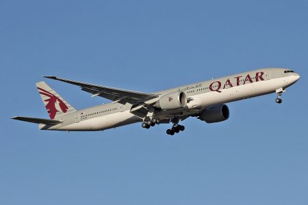 Qatar Airways plane flying in the sky