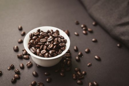 Cup filled with coffee beans